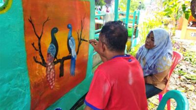 Lukisan dinding objek wisata Desmeldi Kampai ,