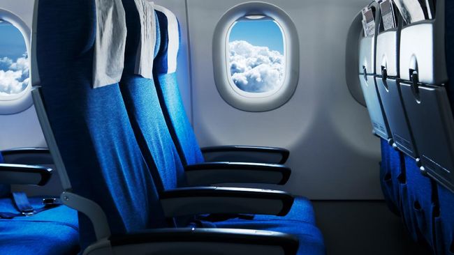 Ilustrasi kursi penumpang di kabin pesawat.